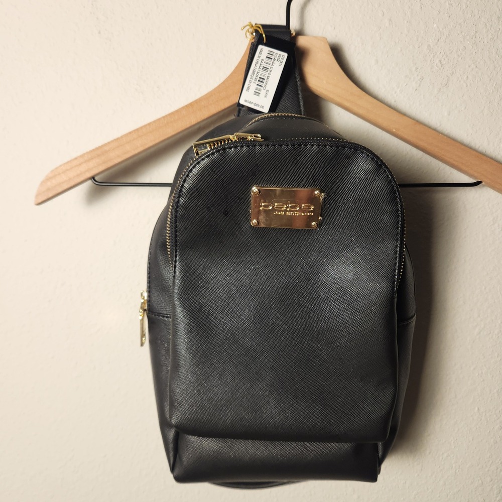Bebe Yolanda Sling Backpack Black Saffiano Faux Leather Gold Hardware E20-1874